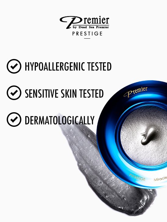 Detalle del tarro azul y textura gris de Milagro Negro de Premier Prestige con información de pruebas en inglés.